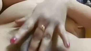Chubby, young lady enjoys fingering her shaved pussy