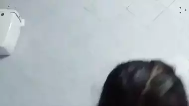 Bengali girl in bathroom strips dresses and nude show